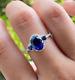 Lab Created Blue Sapphire 2.50ct Oval Cut Halo Women's Ring White Gold Plated