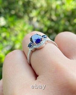 Lab Created Blue Sapphire 2.50Ct Oval Cut Halo Women's Ring White Gold Plated