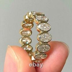 Oval Cut Simulated Diamond Eternity Bezel Wedding Ring In 14K Yellow Gold Plated