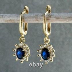 Boucles d'oreilles pendantes en goutte ovale en saphir simulé bleu de 3 carats, plaqué or jaune 14 carats.