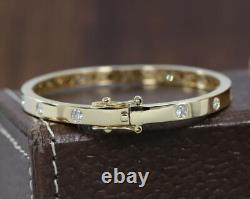 Bracelet jonc pour femme serti de zircones cubiques taillées rondes en plaqué or jaune 14 carats
